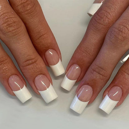 Model wearing classic white French long square press-on nails with a glossy nude base